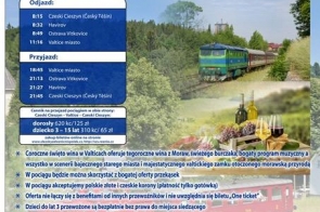 plakat informujący o wycieczce pociągiem na coroczne winobranie w Valticach