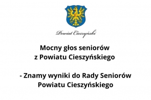 W centralnej części widoczny herb Powiatu Cieszyńskiego z żółtym orłem na niebieskiej tarczy. Poniżej elegancki napis „Powiat Cieszyński” oraz wyraźny, czarny tekst w dwóch linijkach na białym tle.